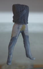 torso and legs of standing figure